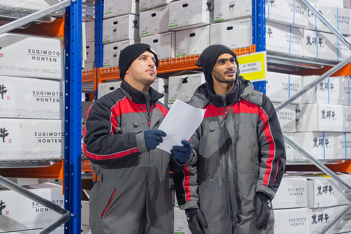 Warehouse team walking in cold room