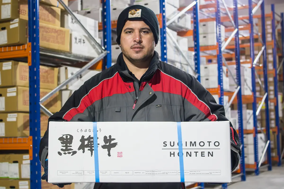 Staff showcasing premium Wagyu